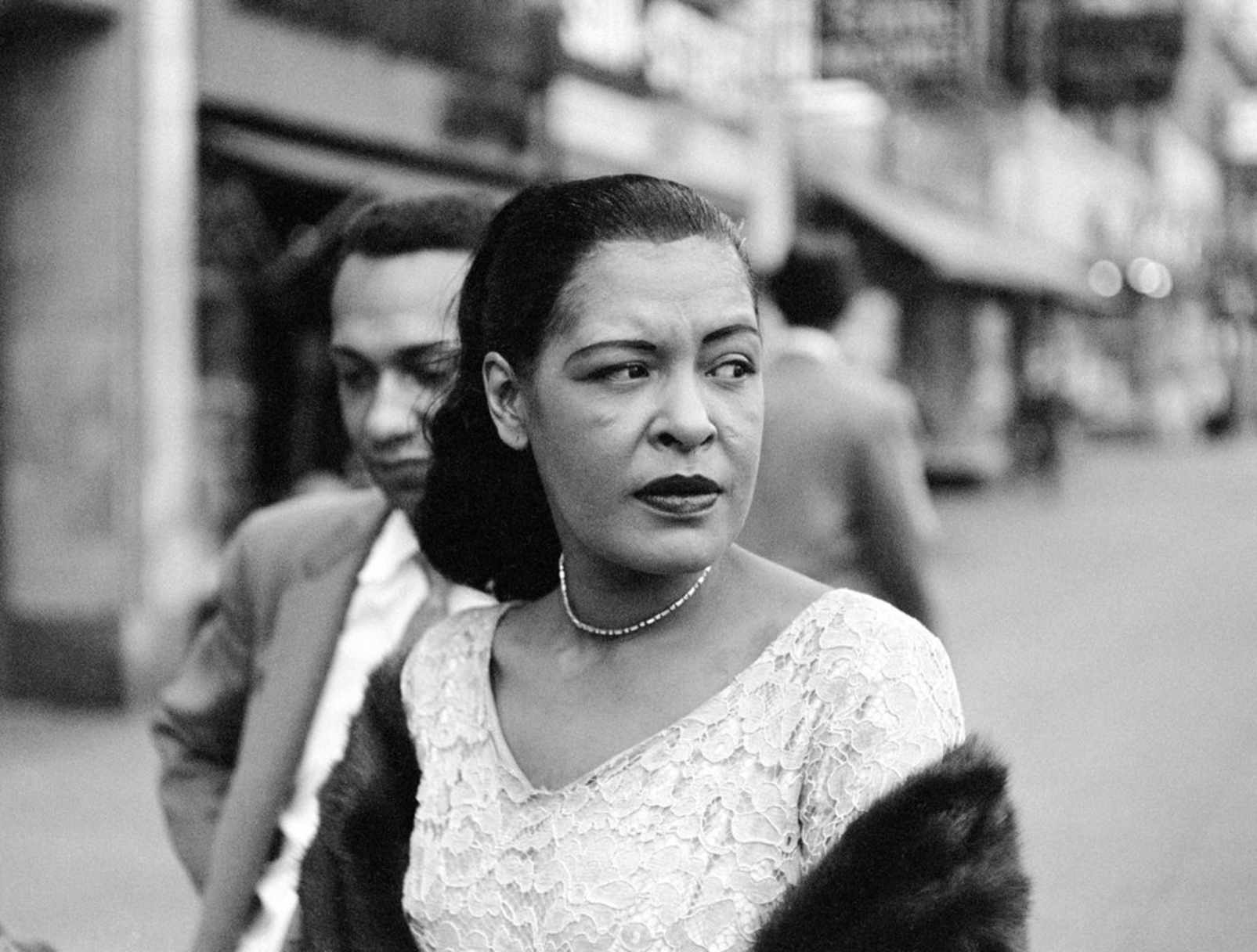 Billie Holiday with Carl Drinkard on Broad Street in New York. Jerry Dantzic