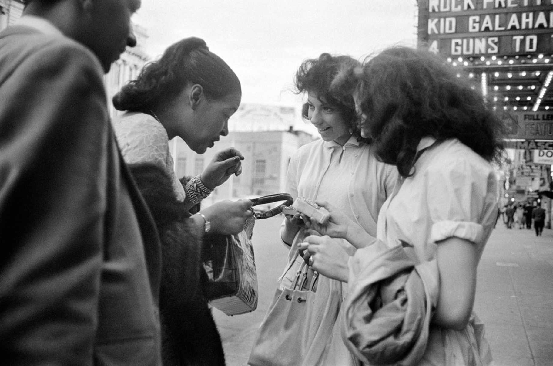 Holiday with Carl Drinkard on Broad Street, receiving a gift from a fan. Jerry Dantzic